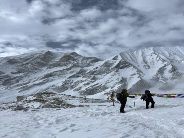 people seeing a snow covered mountain